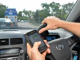 Texting while driving. Photo: Warren Lynam / Sunshine Coast Daily. Picture: Warren Lynam