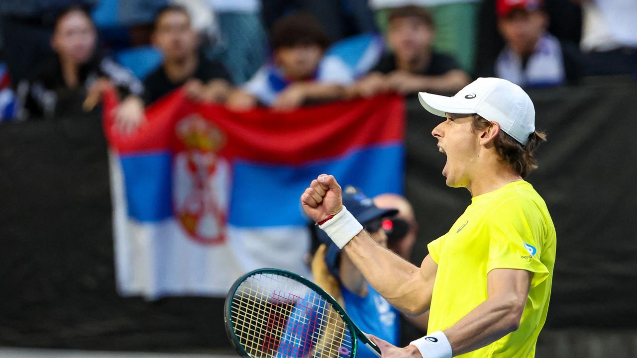 Alex de Minaur celebrates after defeating Novak Djokovic in Perth in a United Cup singles tie in January. Picture: Colin Murty / AFP