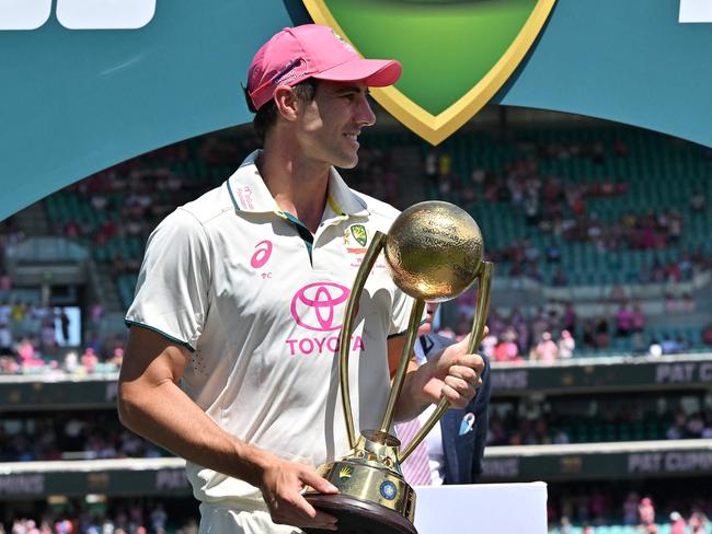 Australiaâs captain Pat Cummins holds The Border-Gavaskar Trophy after winning the fifth cricket Test match and series between Australia and India at the Sydney Cricket Ground on January 5, 2025. (Photo by Saeed KHAN / AFP) / -- IMAGE RESTRICTED TO EDITORIAL USE - STRICTLY NO COMMERCIAL USE --