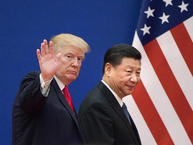 (FILES) This file picture taken on November 9, 2017 shows US President Donald Trump (L) and China's President Xi Jinping leaving a business leaders event at the Great Hall of the People in Beijing. - Call Donald Trump an egomaniac, call him a showoff. Accuse him of getting kicks from insulting and humiliating people. The thing is, he might just agree. The uniqueness of the 45th US president among world leaders extends to the pride he takes in his brazenly unconventional persona. Trump doesn't just admit to a litany of character flaws and actions that would sink an ordinary politician. He revels in them. "The show is 'Trump' and it is sold-out performances everywhere. I've had fun doing it and will continue to have fun." On January 20, 2019, 72-year-old Trump reaches the halfway mark of his presidency's first term. (Photo by Nicolas ASFOURI / AFP)