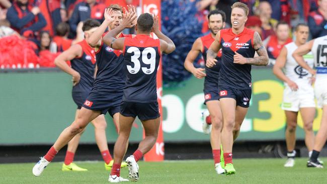 Dom Tyson celebrates a goal with Neville Jetta.
