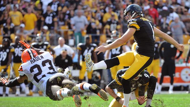 Pittsburgh Steelers kicker Shaun Suisham (6), right, hits a game-winning 41-yard field goal as time runs out in the fourth quarter of an NFL football game, while Cleveland Browns' Joe Haden (23) tries to block it on Sunday, Sept. 7, 2014, in Pittsburgh. The Steelers won 30-27. (AP Photo/Don Wright)