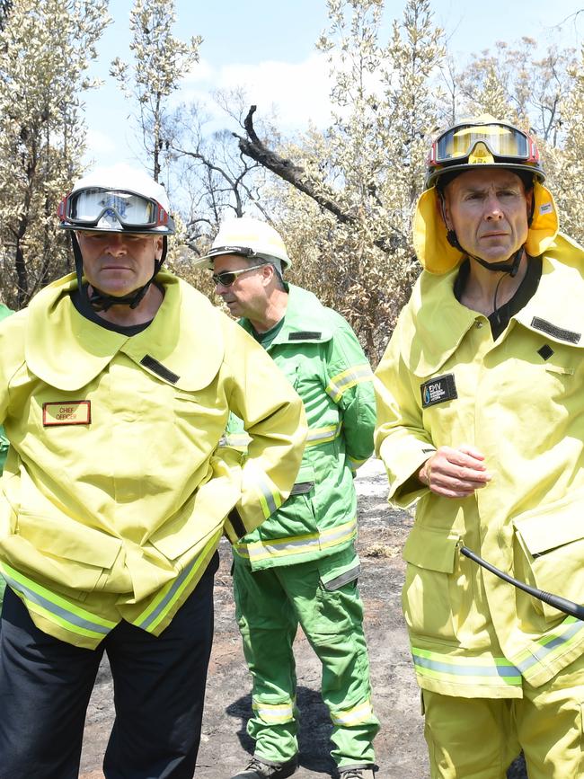 Andrew Crisp, right, and MFB chief Dan Stephens get a tour of the crime scene. Picture: Tony Gough