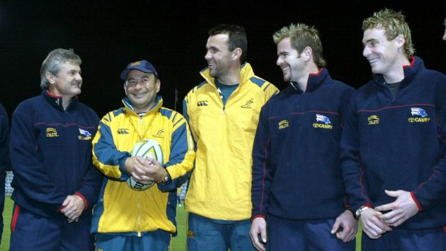 Neil Craig (left) was Adelaide coach back in 2004 when Eddie Jones (second from left) was coach of the Wallabies. Goodwin (far right) was among some Crows to meet the rugby stars.