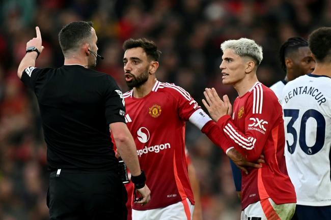 Manchester United captain Bruno Fernandes (C) was sent off in the first half of Sunday's loss to Tottenham