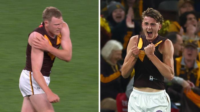 James Sicily comes from the field after injuring his shoulder / while Calsher Dear celebrates after kicking his first AFL goal.
