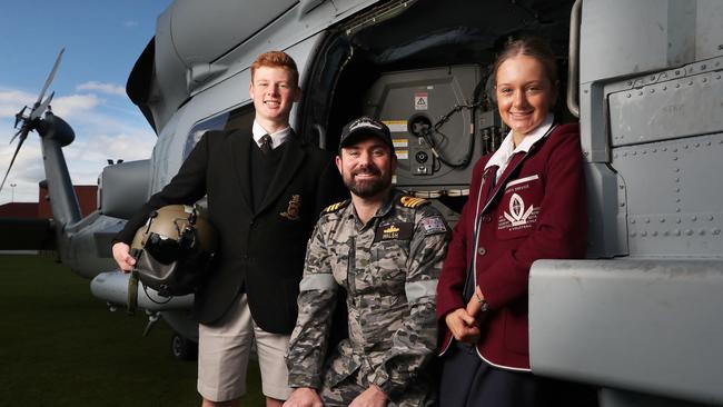 Alastair Walsh Executive Officer HMAS Adelaide who is a former student of The Hutchins School with Jack Wright 16 in year 11 The Hutchins School and Olivia Bridgeman 16 in year 11 at St Michael's Collegiate. Australian Navy visit to The Hutchins School in Sandy Bay. Picture: Nikki Davis-Jones