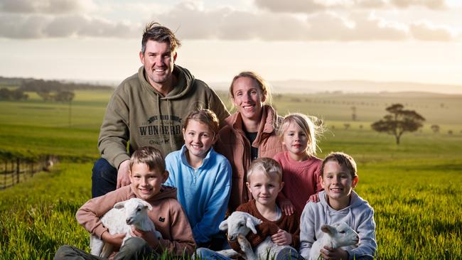 Ben and Kerry Heinrich with their children Archer 9, Emmison 10, Macartney 4, George 6 and Fredrick 8 and Wunderbar Lambs on their Black Springs Property, South Australia. Picture: Matt Turner