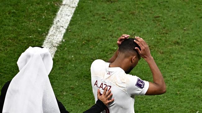 TOPSHOT – Qatar's midfielder #06 Hatim Abdelaziz reacts at the end of the Qatar 2022 World Cup Group A football match between the Netherlands and Qatar at the Al-Bayt Stadium in Al Khor, north of Doha on November 29, 2022. (Photo by Anne-Christine POUJOULAT / AFP)