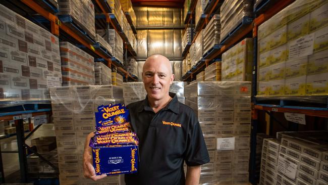 Phil Sims chief executive, Robern Menz with the Adelaide-made Violet Crumble bars in the Glynde SA factory. Picture: James Elsby