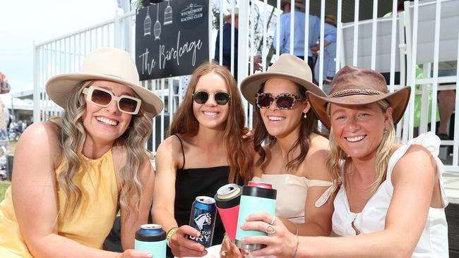 Jess Jobling, Ella Mirtschin, Megan Williamson and Eliza Straford take in the action at the Mt Wycheproof Cup races. Pictures: Yuri Kouzmin