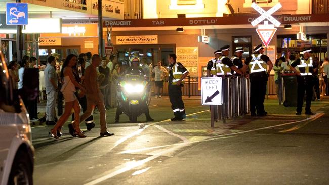 Police and SA Ambulance officers on at the corner of Colley Tce and Jetty Rd on New Year’s Eve 2016.