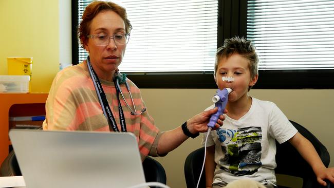 Cooper undergoing more tests to see how he reacts with research nurse Helen Czech. Pictures Tim Carrafa