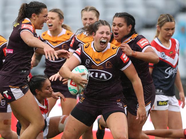 SYDNEY, AUSTRALIA - OCTOBER 25:  Chelsea Lenarduzzi of the Broncos celebrates with team mates after scoring a try during the NRLW Grand Final match between the Brisbane Broncos and the Sydney Roosters at ANZ Stadium on October 25, 2020 in Sydney, Australia. (Photo by Mark Kolbe/Getty Images)