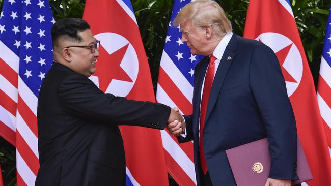 Kim Jong-un and Donald Trump shake hands at the end of their meetings on Sentosa in Singapore this week. Picture: AP