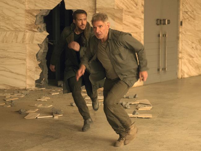 This image released by Warner Bros. Pictures shows Ryan Gosling, left, and Harrison Ford in a scene from "Blade Runner 2049." (Stephen Vaughan/Warner Bros. Pictures via AP)