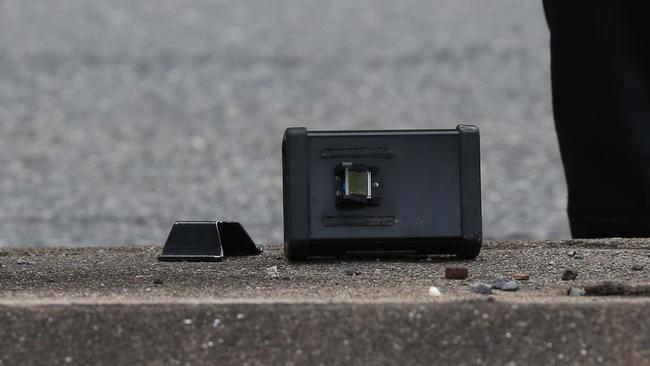 The officer’s LIDAR scanner was seen shattered on the median strip hours after the alleged hit and run. Picture: Zak Simmonds