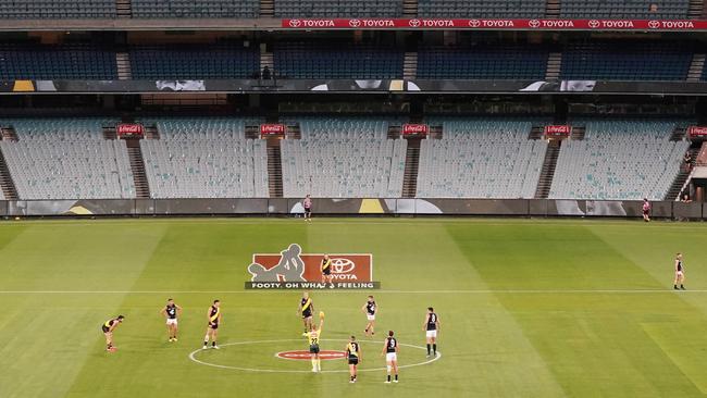 First bounce during the Round 1 AFL match between Richmond and Carlton at the MCG in Melbourne. Previously this was the nightmare scenario for the AFL but after two whirlwind weeks this was a win for the league. (AAP Image/Michael Dodge)