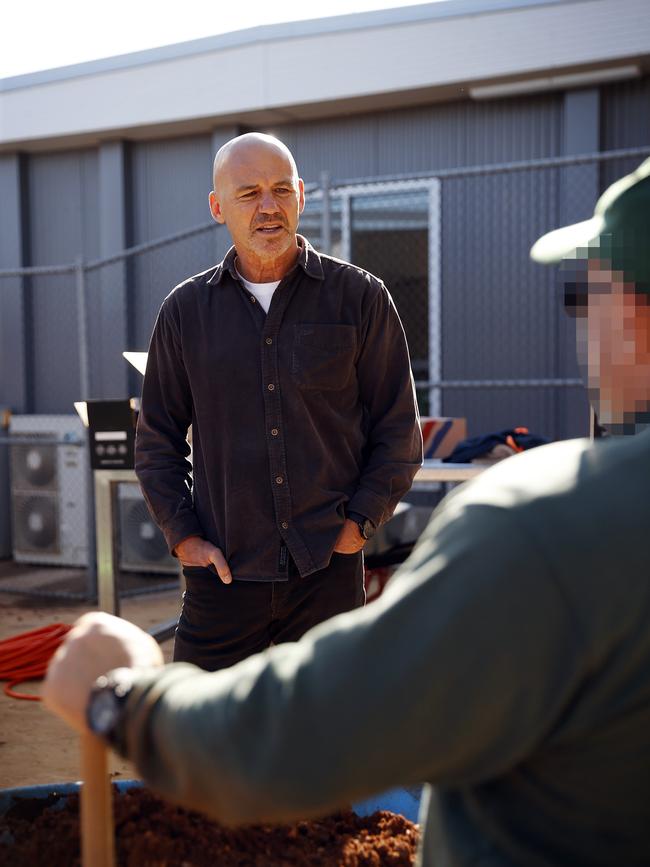 Gary Jubelin talks to prisoners in the vegetable garden. Picture: Sam Ruttyn