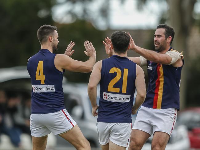 Chris Smith (left) celebrates a goal for Caulfield Bears. Picture: Valeriu Campan