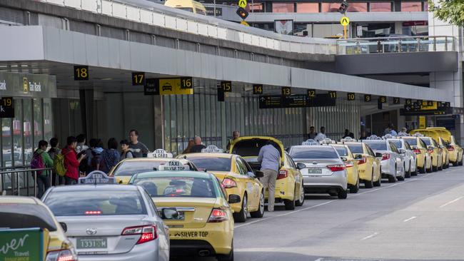 Touting drivers have been hassling travellers inside the terminals at Melbourne Airport. Picture: Jason Edwards