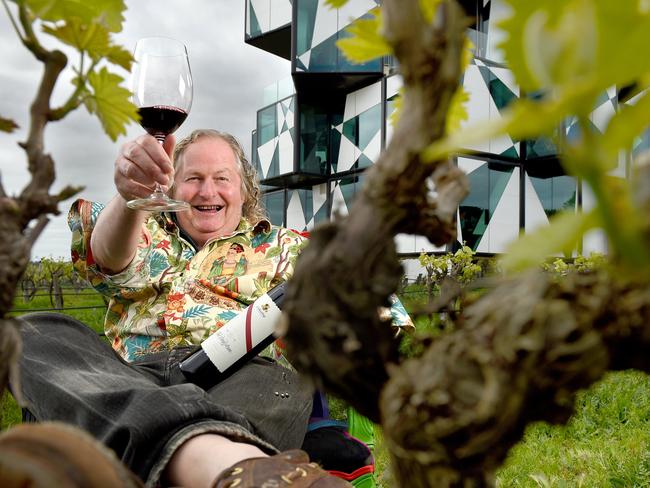 4/10/18 - Sunday Mail survey splash yarn ... optimism is up. Winemaker Chester Osborn from d'Arenberg celebrates good times, increased optimism and suggests a drop of Dead Arm 2015 Shiraz is the perfect drink to go with good times. Photo - Naomi Jellicoe