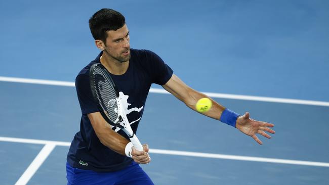 Novak Djokovic plays a forehand during a practice session at Melbourne Park ahead of the 2022 Australian Open. Picture: Getty Images