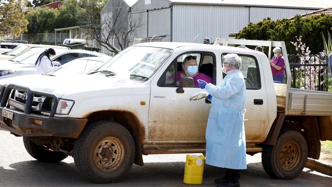 Doctor Khaled Bardwawil talks and treats patients in their cars out the front of the Lake Cargelligo Family Practice. Picture: Chris Pavlich