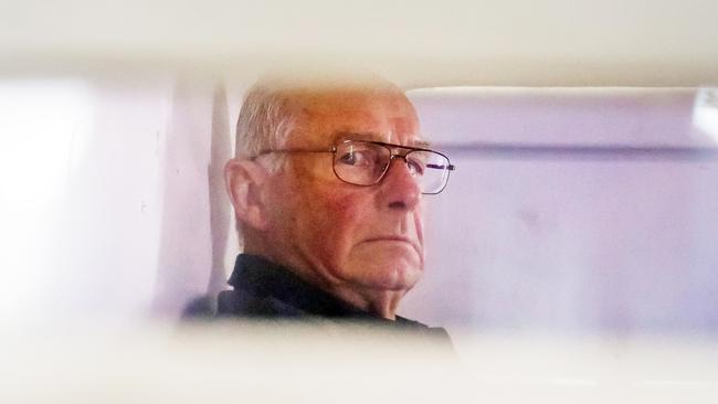 Rogerson inside a police truck being taken into Bankstown Court after being arrested for Gao’s murder. Picture Craig Greenhill