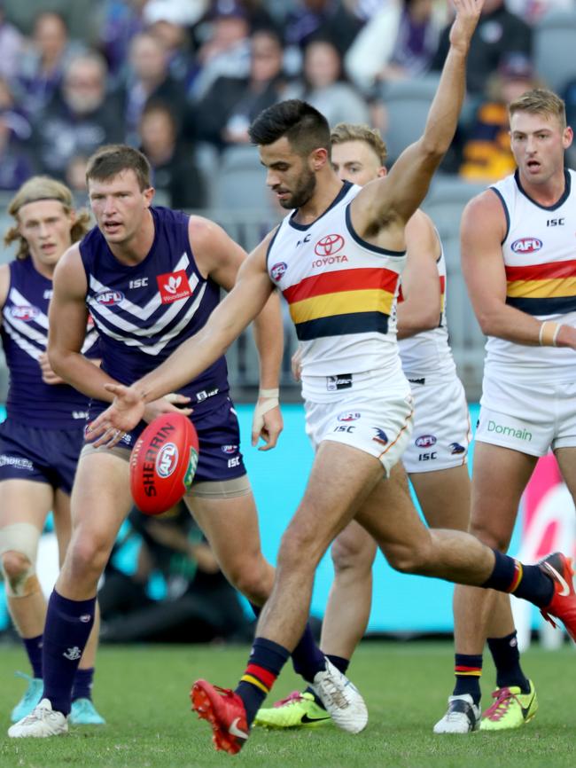 Wayne Milera shows his poise off halfback for the Crows. Picture: AAP Image/Richard Wainwright