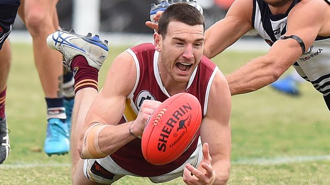 Darcy Barden fires out a handball for Lower Plenty. Picture: Josie Hayden