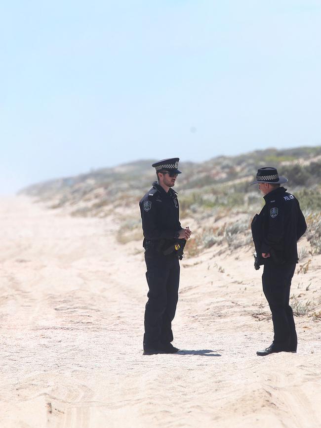 Police examine the scene where two female backpackers were allegedly kidnapped and assaulted near Tea Tree Point in the Coorong. Photo: Calum Robertson