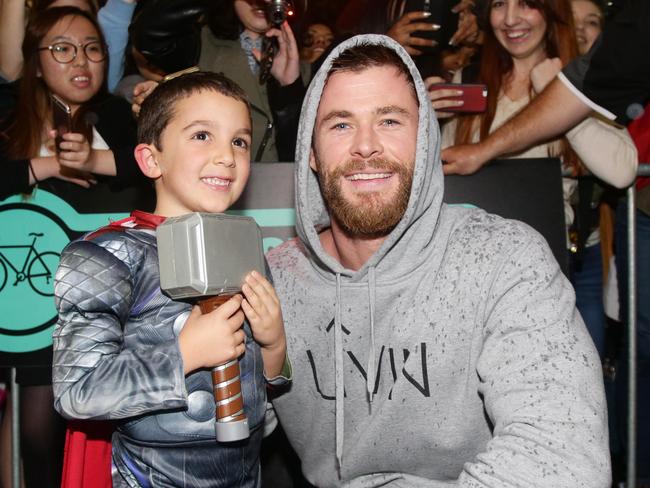 Chris Hemsworth, in Brisbane with Thor fan Jacob Whittle, voices the stunning new campaign. Picture: Steve Pohlner