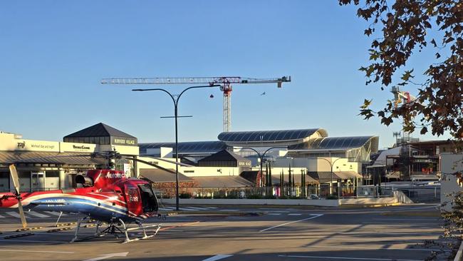 A helicopter has landed to transport plant and equipment at Burnside Village. Picture: Andrew Cohen