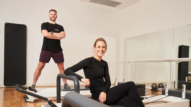 Kickboxer Matt Stevens with gym owner and instructor Clancy Sullivan from FORM Pilates &amp; Barre in Glenelg. Picture: Matt Loxton