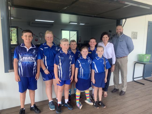 Communities and Housing Minister Leeanne Enoch with Ambrose State School Principal Andrew Collis and students who have benefitted from the school's breakfast program.