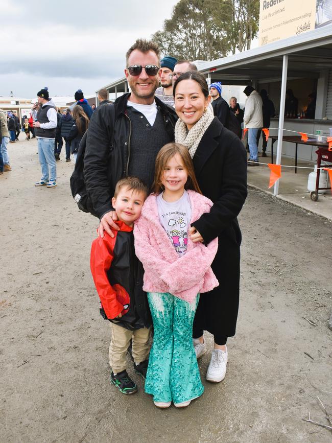 West Gippsland league grand final match 2024 — Phillip Island Bulldogs V Nar Nar Goon "The Goon" Football Club at Garfield Recreation Reserve on September 14, 2024: Chris Hooper, Tara Hooper, Jack and Isabel. Picture: Jack Colantuono