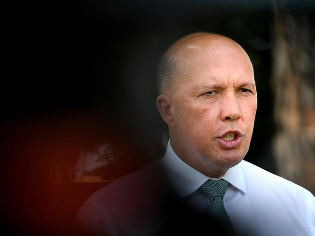 Minister for Home Affairs Peter Dutton speaks to the media during a doorstop in Kallangur, Queensland, Thursday, February 7, 2019. (AAP Image/Albert Perez) NO ARCHIVING