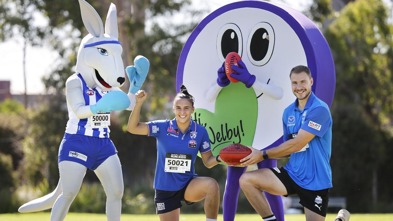 The North Melbourne mascot and the Good Friday Appeal mascot meet Western Bulldogs AFLW player Bailey Hunt and North Melbourne player Ben Mckay ahead of the AFL’s Good Friday Kick for the Kids match on April 15, 2022. Picture: Alex Coppel.