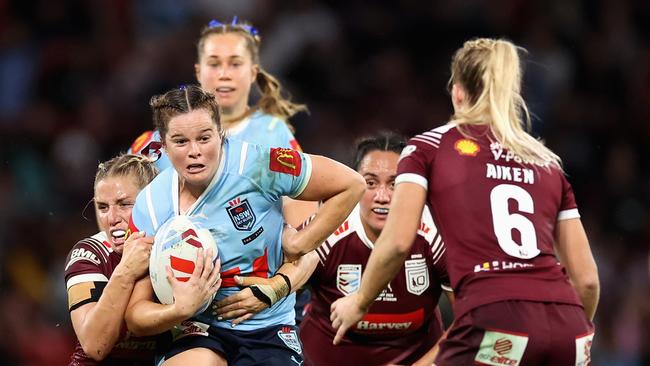 NSW Blues’ Rachael Pearson takes a hit up during Game 1 of the 2024 Women’s State of Origin. Picture: Hannah Peters