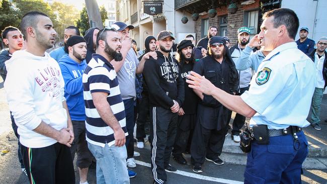 Islamic State terrorists Khaled Sharrouf (centre, in sunglasses) and Mohamed Elomar (left of Sharrouf, with full beard) at the 2012 gathering that turned into a violent rampage.