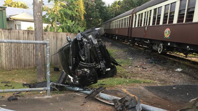 A car has rolled on its side following a collision with an oncoming Kuranda Scenic Rail train in Cairns North.