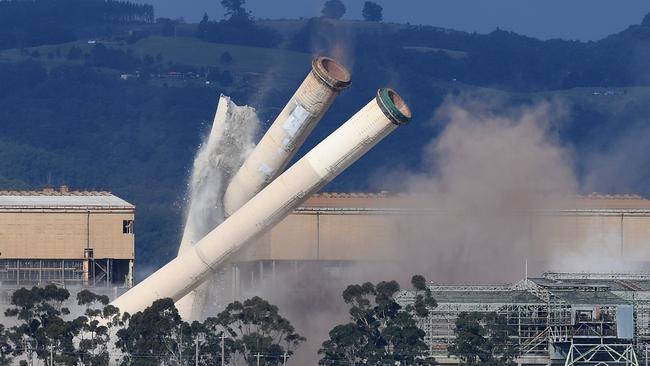 Dozens of people watched from afar as the demolition began. Picture: AAP