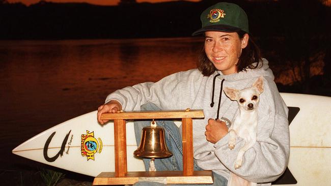 Menczer in 1996 with the Bells Beach Trophy and pet dog Speck.