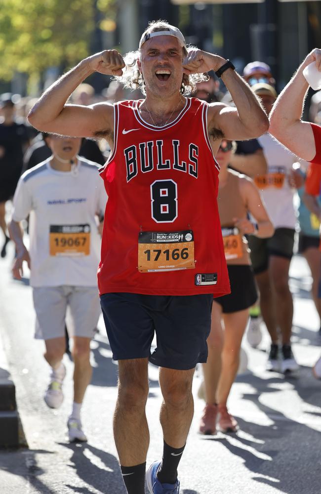 A Bulls fan cheers as he takes on the Run for the Kids course. Picture: Michael Klein