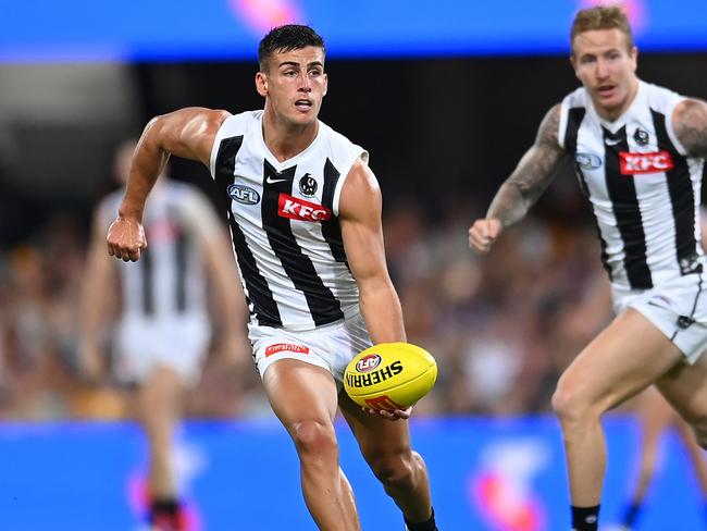 BRISBANE, AUSTRALIA - MARCH 28: Nick Daicos of the Magpies in action during the round three AFL match between Brisbane Lions and Collingwood Magpies at The Gabba, on March 28, 2024, in Brisbane, Australia. (Photo by Albert Perez/AFL Photos via Getty Images )