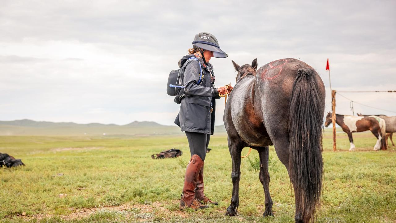 Warwick's Kelly Dudley prepares a horse during the 2024 Mongol Derby.