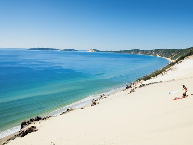 Couple at Carlo Sand Blow, Great Sandy National Park near Rainbow Beach. Picture: Tourism and Events Queensland