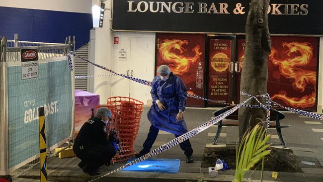 Police comb the scene outside the Beer Garden, in Surfers Paradise, after Raymond Harris allegedly fatally stabbed in September, 2020.