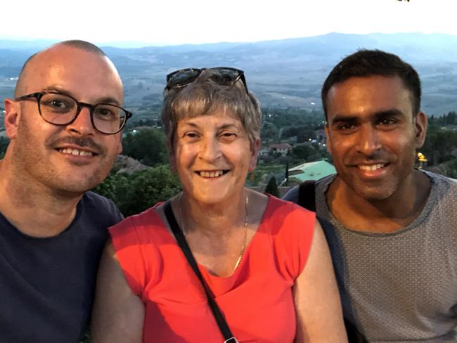 Simon Wellington with his mum Fay Wellington and his partner Dr Sanjeev Kumar on a trip to Tuscany, in 2018. Picture: Supplied